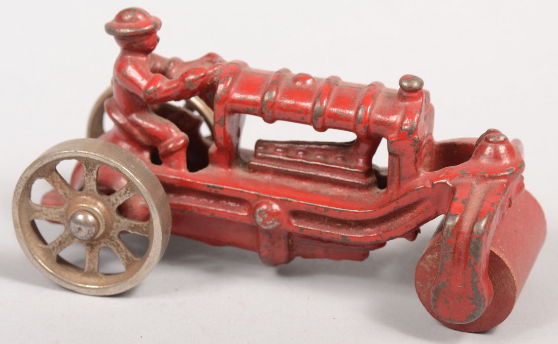 A. C. Williams Red Road Roller Cast Iron Toy. Nicke: A. C. Williams Red Road Roller Cast Iron Toy. Nickel plated rear wheels with red painted wood roller on front. 2 1/4"h. X 4 1/16"