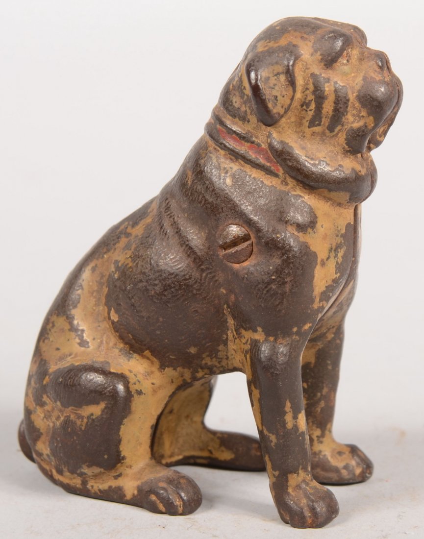 Kyser & Rex Seated Pug Dog Still Bank. Remnants of: Kyser & Rex Seated Pug Dog Still Bank. Remnants of old tan paint and red collar on cast iron. 3 1/2"h.