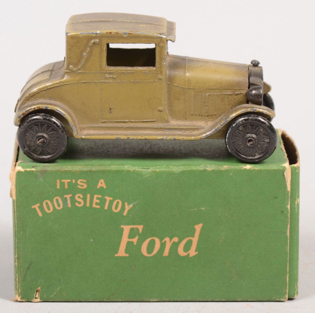Green Tootsietoy Model A Ford Coupe with Green Box: Green Tootsietoy Model A Ford Coupe with Green Box. Model 4655 with black cast wheels and radiator. 1 5/16"h. X 2 9/16"l.