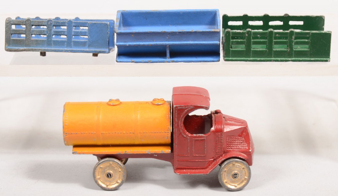 Tootsietoy Mack "C" Cab Truck with Four Interchang: Tootsietoy Mack "C" Cab Truck with Four Interchangeable Beds. Maroon painted cast truck has gilt cast wheels with two stack beds, green and blue, a yellow-orange tank and a blue coal hopper. 3 1/4"l.