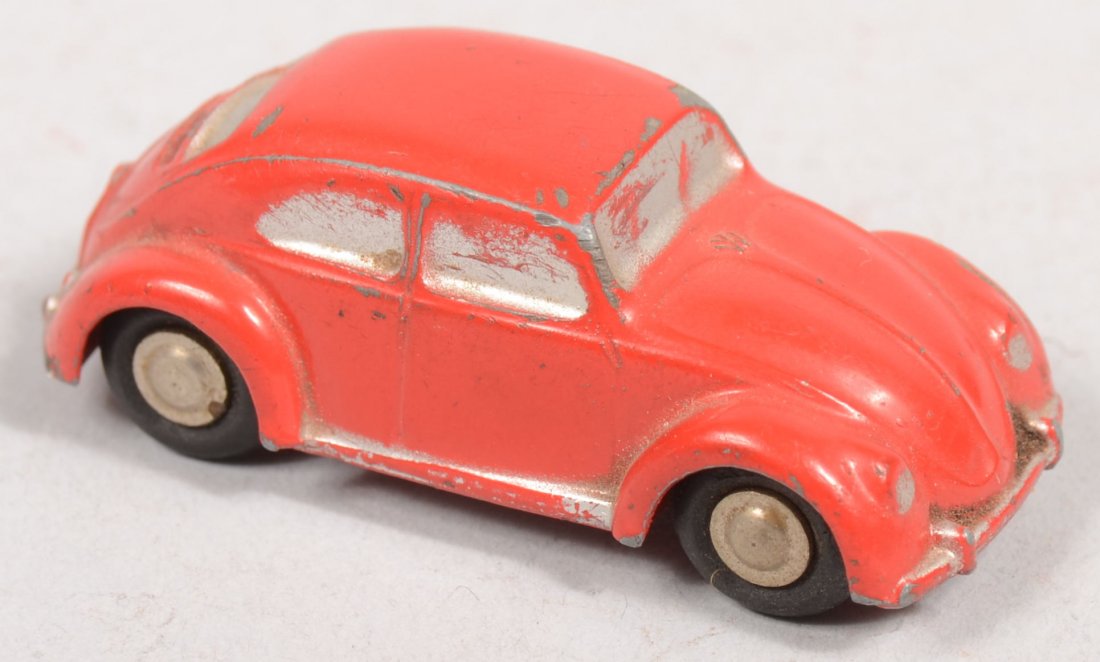 A Red Schuco Volkswagen Piccolo 712. Silver accent: A Red Schuco Volkswagen Piccolo 712. Silver accents, black rubber tires on plated steel wheels. 1 15/16"l.