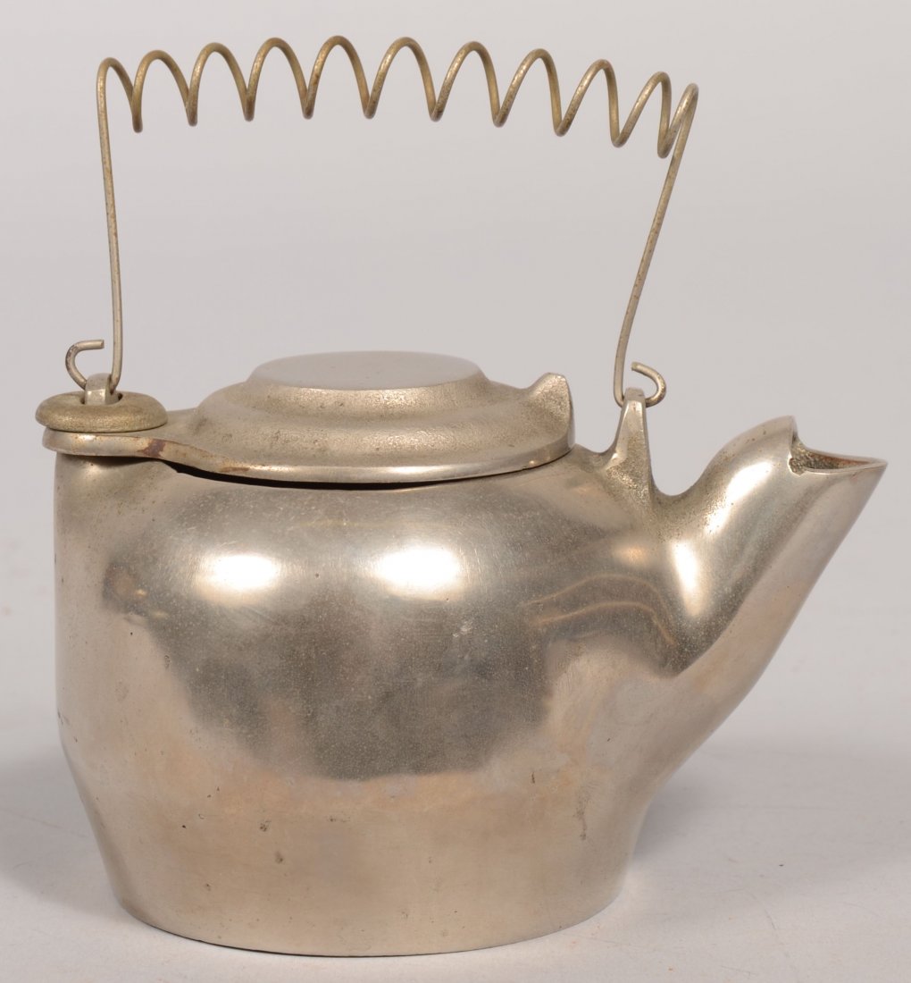 Small Kenton Nickel Plated Hot Water Kettle. Havin: Small Kenton Nickel Plated Hot Water Kettle. Having a swing lid and coiled wire handle. Marked on bottom. 3 1/4"h. X 5 1/4"l.