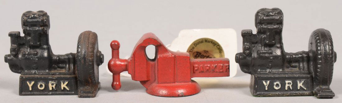 Three Industrial Type Painted Cast Iron Promotiona: Three Industrial Type Painted Cast Iron Promotional Pieces. Type given by manufacturing businesses. A solid red bench vise marked: "Parker , Meriden, Conn." on the tail stock, 2 7/8"l. Along with two