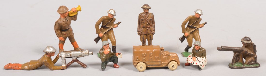 Nine Piece Mixed Group of Cast iron and Pot Metal : Nine Piece Mixed Group of Cast iron and Pot Metal Soldiers. Prone machine gunner with tripod gun, kneeling machine gunner, two running riflemen, standing officer no weapons, cast rubber bugler, two po