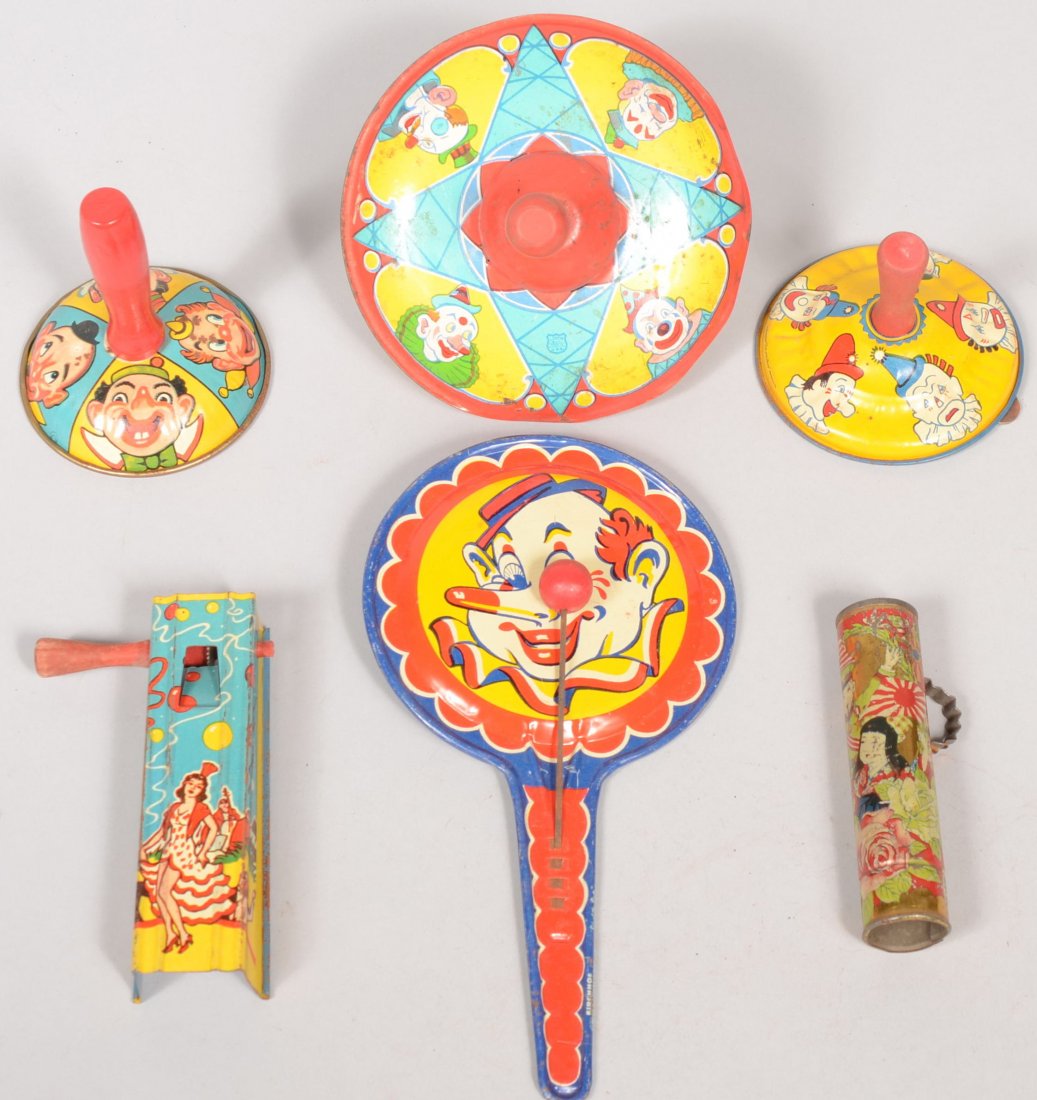 Group of Music Makers in Lithographed Tin. A ratch: Group of Music Makers in Lithographed Tin. A ratchet rattle with woman on front and wooden handle, 4 3/4"l.; two bell ringers, a yellow and a yellow with blue, both with clowns and red wood handles, o
