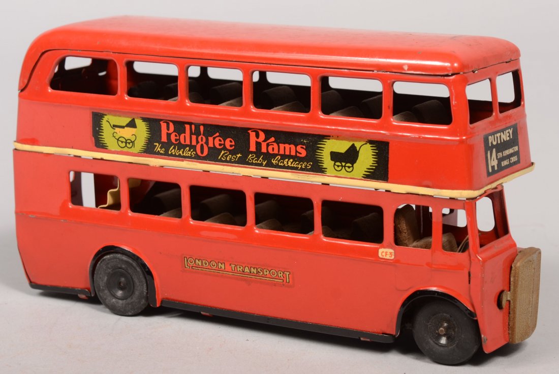 Very Nice Minic Double Decker English Bus. Marked : Very Nice Minic Double Decker English Bus. Marked on bottom: "Tri-ang Minic Toys." and "Tri-ang Toys, Line Brothers Limited." Painted red and having eight signage decals, plated front grille, 22 black