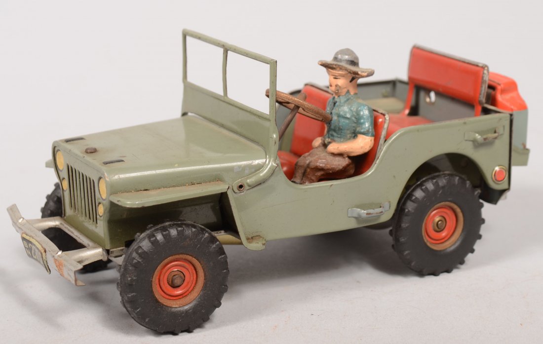 Arnold Friction Motor Jeep. Marked: "Made in U.S.-: Arnold Friction Motor Jeep. Marked: "Made in U.S.-Zone Germany" on bottom. Gray-green body with red seats, fold down windscreen, smoking driver, jerry can and four black rubber tires on red tin wheels
