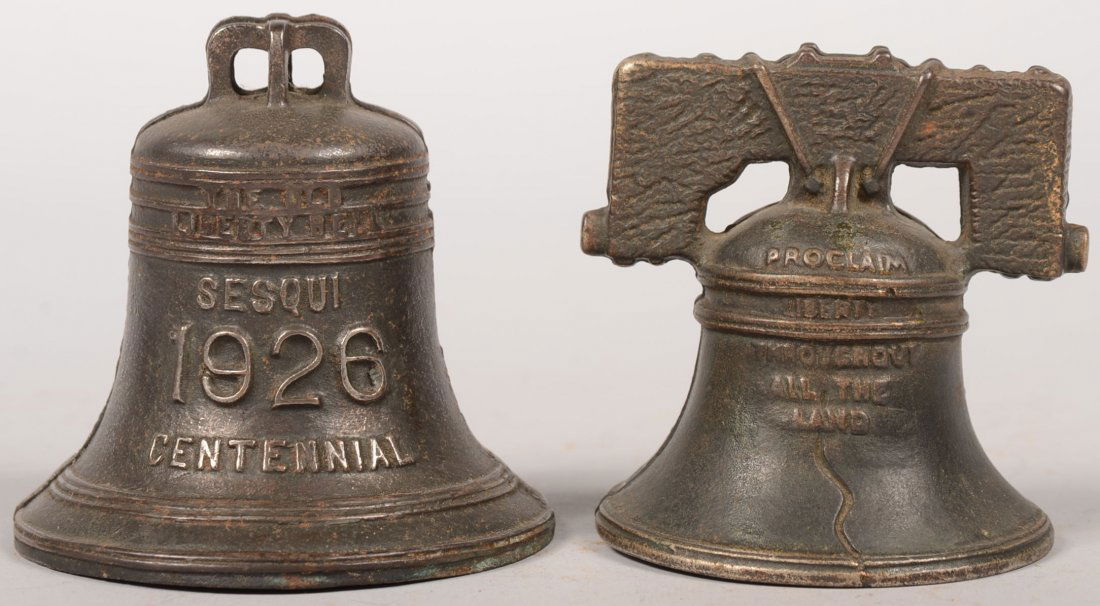 Two Liberty Bell Cast Iron Still Banks. A "1776/19: Two Liberty Bell Cast Iron Still Banks. A "1776/1926 Sesquicentennial Bell bank. Produced by Grey Iron Co., 3 3/4"h. X 4"dia. Together with a bronzed liberty Bell with yoke produced by Arcade. 3 1/2"h