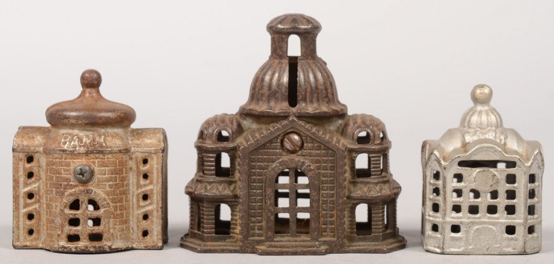 Three Small Cast Iron Still Bank Buildings. A Grey: Three Small Cast Iron Still Bank Buildings. A Grey Iron Casting Co. Domed "Mosque" Bank, c.1903 - 1928, 4"h. X 4 1/4"w. A small "Presto" Bank by A.C. Williams, 3 1/8"h. X 2 3/4"w. and a smaller still 