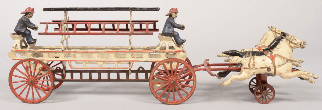 Wilkens Three Horse Hook and Ladder Wagon with red: Wilkens Three Horse Hook and Ladder Wagon with red high spoke wheels, two blue drivers, two white and one black "galloping" horses, red bell traces, white carriage with four metal ladders. 21 1/2"l.
