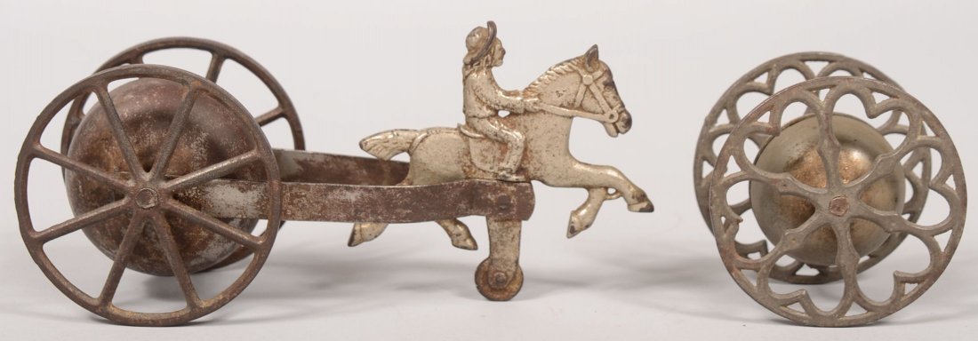 Two Bell Ringer Pull Toys of Cast Iron . High spok: Two Bell Ringer Pull Toys of Cast Iron . High spoked wheels attached to a nickel plated horse with cowboy rider. 7"l. Along with a similar yo-yo type bell toy with heart shaped cast iron wheel spokes.
