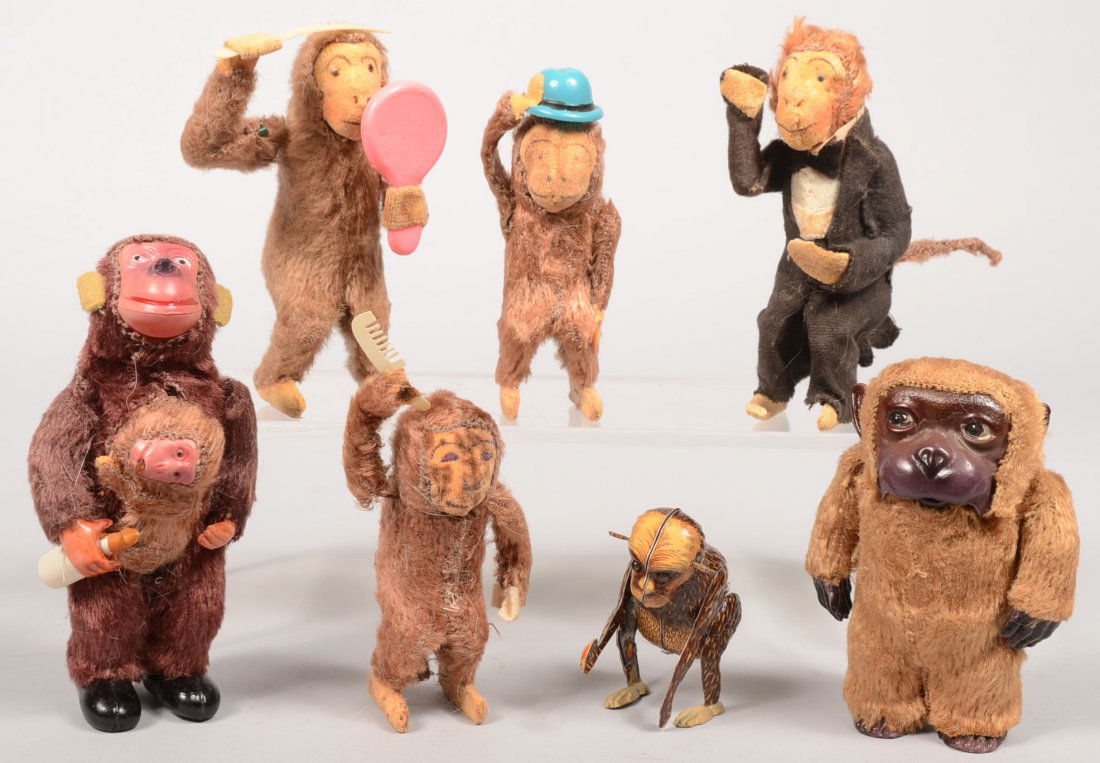 Seven Member Group of Wind-Up Monkeys. Six have fa: Seven Member Group of Wind-Up Monkeys. Six have faux fur covered bodies and key in back. Two have moving heads/mouths, four(family) have spinning tails and combing hair or tipping hat. 4"- 5"h. Last m