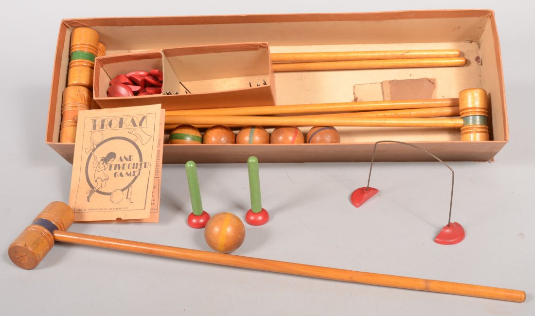 Six "Gold Metal" Games in One Box by Transogram. F: Six "Gold Metal" Games in One Box by Transogram. Floor Kro-Kay, Arch Pin, Horseless Polo, Chinese Camel Race, Wicket Golf and Mallet Skee Ball. Original box contains: six wood mallets, six balls, nine
