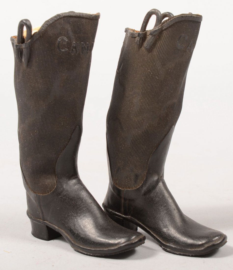 Pair of Candee Brand Salesman Sample Rubber Boots.: Pair of Candee Brand Salesman Sample Rubber Boots. Marked at top of front and with "C" on heel. Vulcanized fabric tops and cast rubber foot. Black. 4 3/4"h.