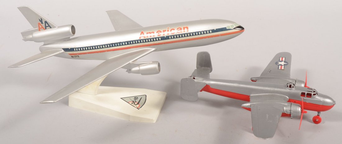Hubley Plastic B-25 Mitchell Medium Bomber with a : Hubley Plastic B-25 Mitchell Medium Bomber with a American Airlines DC-10 Promotional. Hubley plane is red and silver plastic marked on bottom, 8 3/4"l. X 11 1/4"w. Promotional on stand with appropria