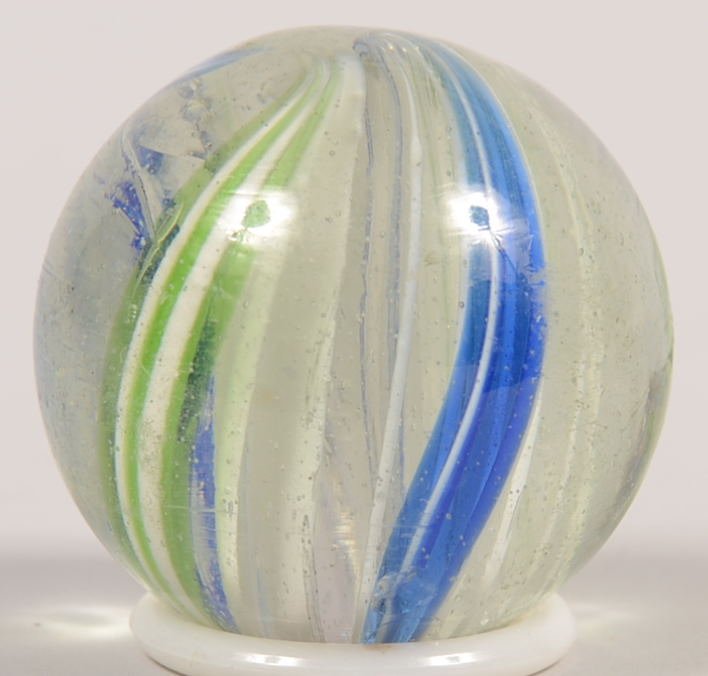 Antique Multi Stripe Crystal Glass Marble. Two blu: Antique Multi Stripe Crystal Glass Marble. Two blue with white and two green with white stripes along with twelve white only stripes with little swirl. 1 9/16"dia.