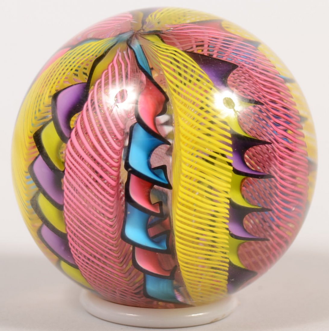 Twelve Cane Filigrana Marble Signed "J. Wilson, To: Twelve Cane Filigrana Marble Signed "J. Wilson, Toccali." Latticino spirals and bi-color ribbons in a crystal sphere. 2 1/8"dia.