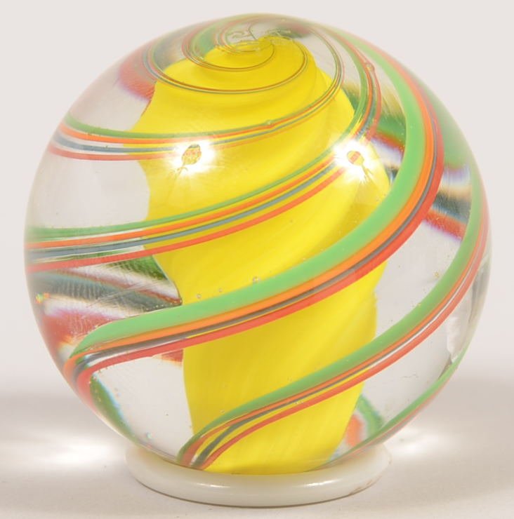 Large Handmade Crystal Marble Signed "JHM, 99." Jo: Large Handmade Crystal Marble Signed "JHM, 99." John Hamon Miller produced with a central solid yellow spiral surrounded by four bands of green, yellow, blue and red threads. Signed on end. 2 15/16"di
