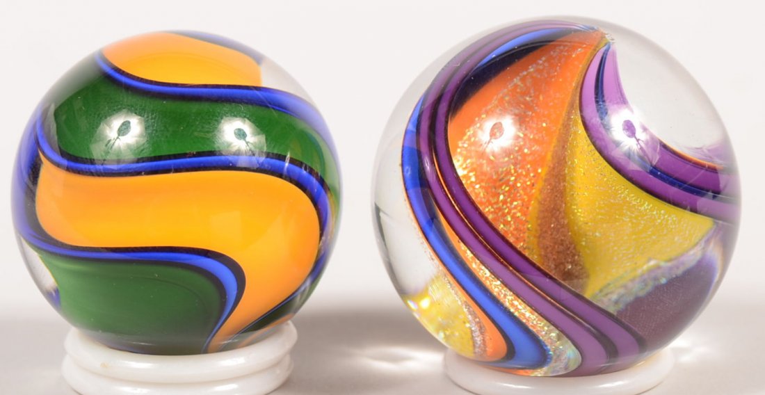 Signed Contemporary Handmade Glass Marble with ano: Signed Contemporary Handmade Glass Marble with another example. First marked: "FES, '05" on one end for Eddie Seese. Marble is divided into two halves internally by a wide opaque swirl, yellow on one 