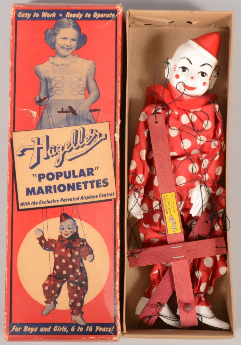 Hazelle's Popular Marionette, 810 Teto, The Clown.: Hazelle's Popular Marionette, 810 Teto, The Clown. Doll in original illustrated box. White faced plastic head with red hat and face details. Dressed in a white polka dotted red jump suit with white pl