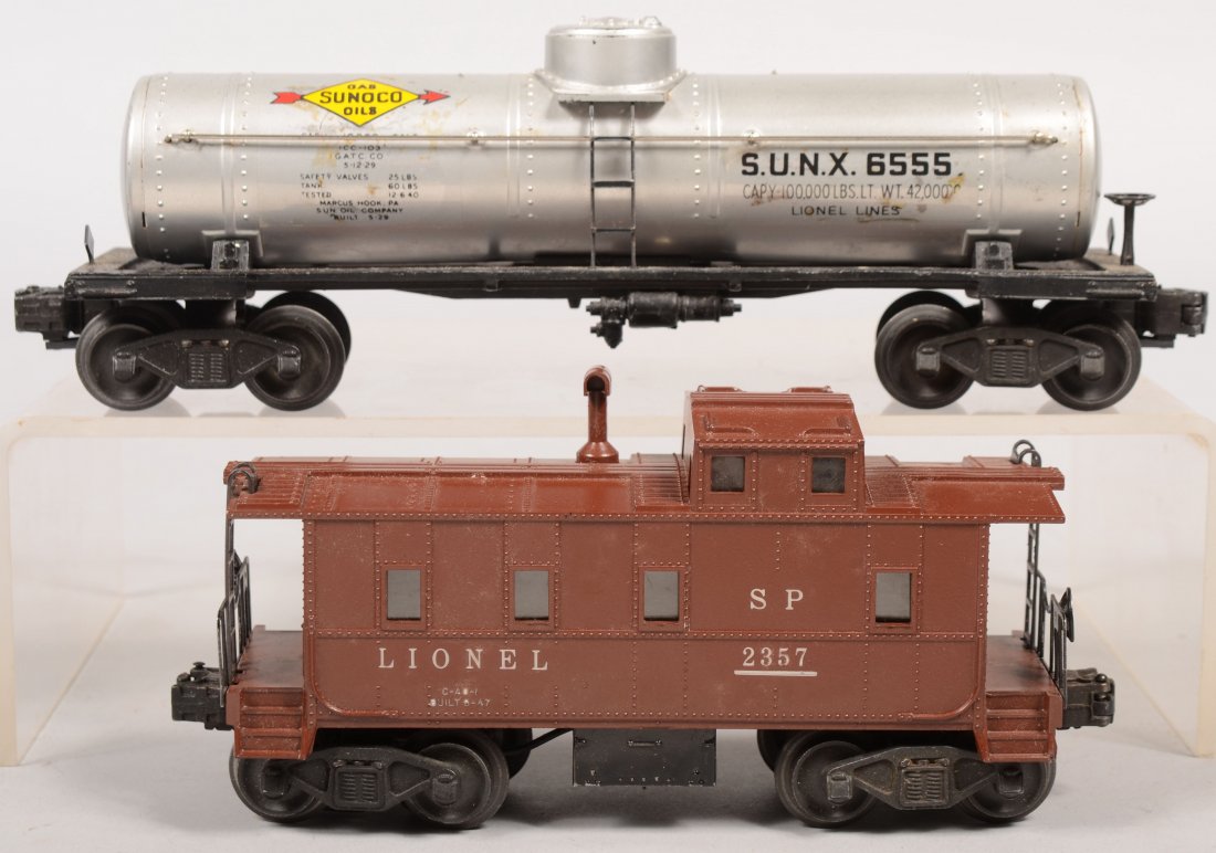 Two Lionel Post War O Gauge Cars. 6555 silver Suno: Two Lionel Post War O Gauge Cars. 6555 silver Sunoco Tank Car Type I large letter with standard couplers. Together with SP 2357 Type I Tuscan body Caboose with electro-coil couplers.