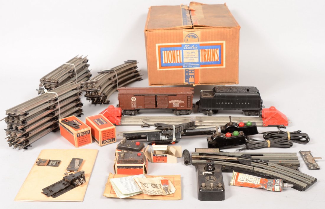 Lionel Accessories Group with Box Car. All pieces : Lionel Accessories Group with Box Car. All pieces in a #140, "O" gauge Passenger Train Outfit box. Including: 23 pcs. straight track; 2 red bump stops; 1 straight uncoupler/unloader with control; 8 pc