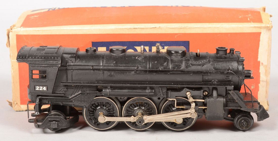 Lionel #224 2-6-2 Post War Steam Engine Type II. T: Lionel #224 2-6-2 Post War Steam Engine Type II. This engine model has short black tender drawbar, curved and extended cab floor, but with blackened hand rails. Also with directional switch on boiler,