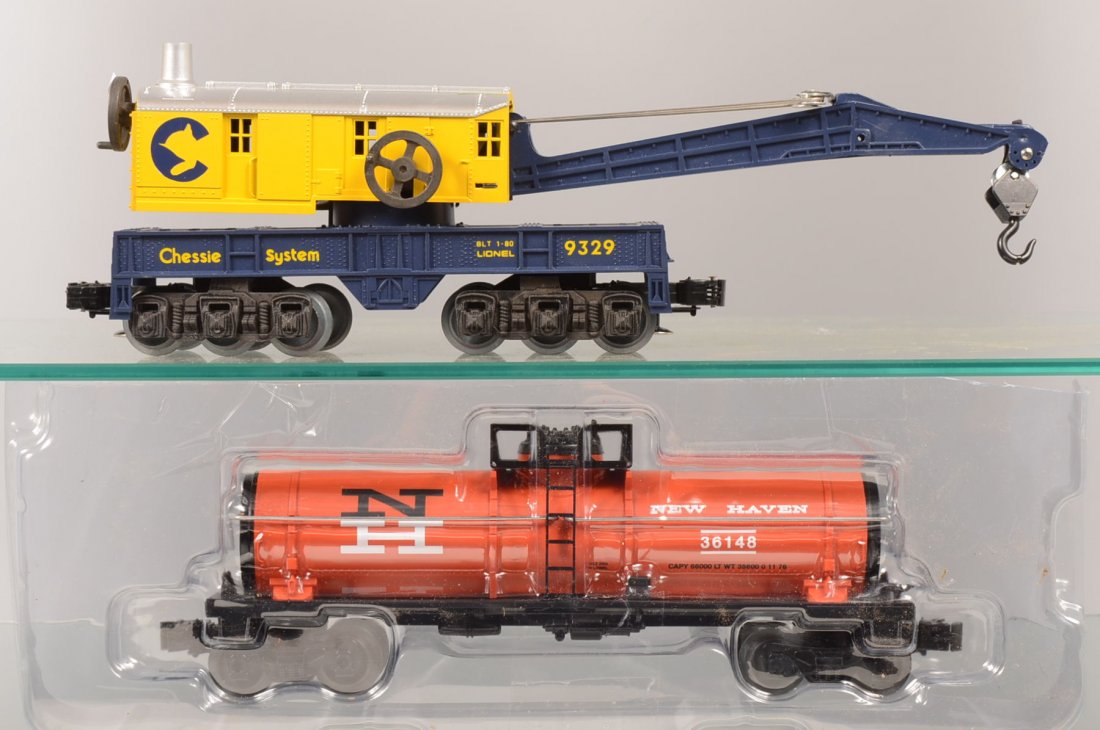 Two Lionel Modern Rail Cars. A 9329 Chessie System: Two Lionel Modern Rail Cars. A 9329 Chessie System Heavy Crane and a New Haven Single Dome Tank Car, 36148. Tanker in plastic blister pack.