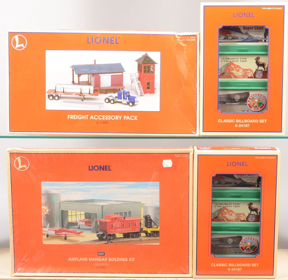 Four Lionel Accessory Sets. Two Classic Billboard: Four Lionel Accessory Sets. Two Classic Billboard Sets, 24187, in original boxes. A new in box, 12951, Airplane Hanger Building Kit and a Freight Accessory Pack, 11975, in original box.