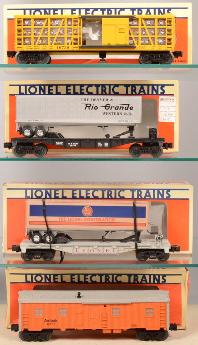 Four Lionel Rail Cars. 16702, orange Amtrak Bunk C: Four Lionel Rail Cars. 16702, orange Amtrak Bunk Car with illuminated interior; 16739, Warner Bros. Foghorn Leghorn Poultry Car, yellow with interior lighting and Foghorn character; 16374, black D&RGW