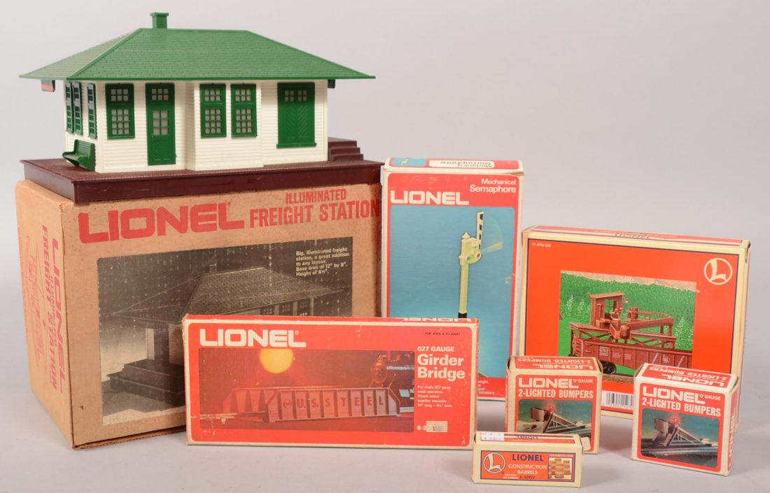 Group of Lionel Train Yard Accessories. 2133, Lion: Group of Lionel Train Yard Accessories. 2133, Lionel Illuminated Freight Station. Plastic building in white with green roof, trim and a brown base; 2214, Girder Bridge of heavy gray plastic; 2312, Mec
