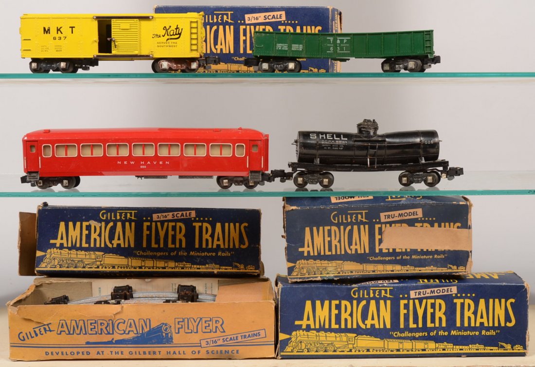 Five Piece American Flyer Model Rail Group. This g: Five Piece American Flyer Model Rail Group. This group of cars have the later knuckle coupler and include: a green,631 T & P gondola; yellow, 637 MKT "Katy" boxcar; black, 681 Shell Oil single dome ta