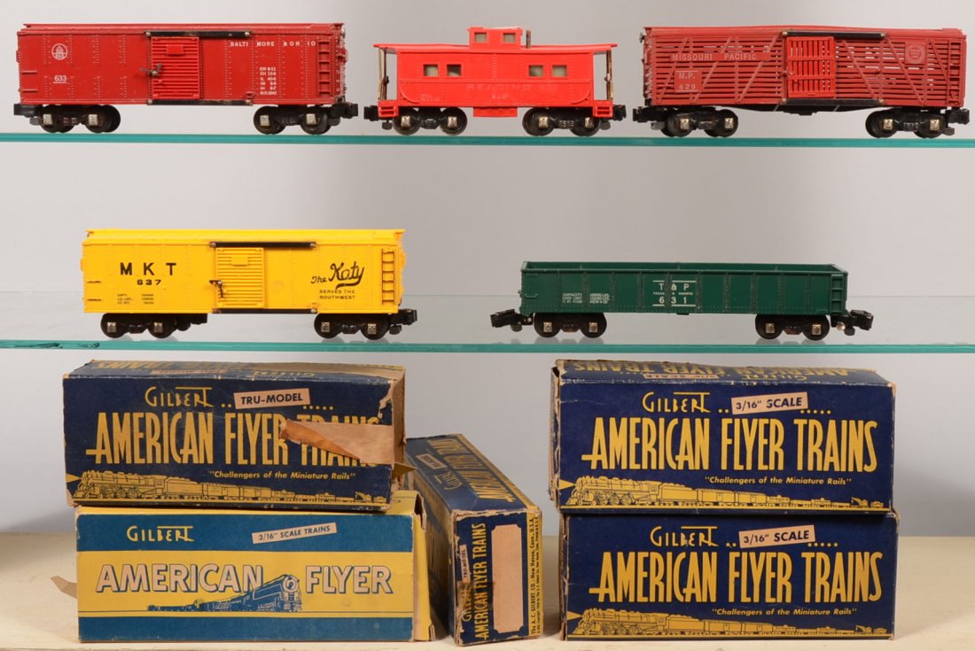 Five American Flyer Model Rail Cars. This group ha: Five American Flyer Model Rail Cars. This group has the knuckle couplers. Red, 633, B&O Boxcar; green, 631, T&P Gondola; yellow, 637, MKT "The Katy" Boxcar; red Missouri Pacific Cattle Car. Al with Gi