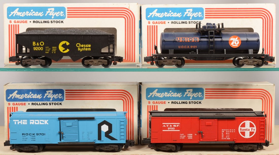Four American Flyer S Gauge Rail Cars in Original : Four American Flyer S Gauge Rail Cars in Original Boxes. #9101, dark blue Union Oil Tank Car; #9200, black B&O Chessie System Hopper Car; #9700, red A.T. & S.F. Boxcar; 9701, light blue The Rock Boxca