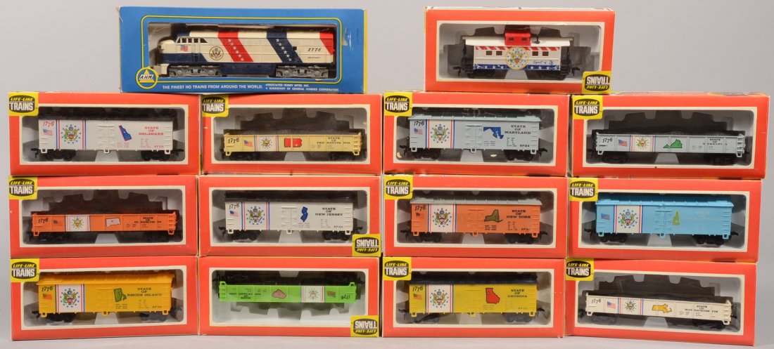 HO Gauge Bicentennial Train. Fifteen piece group.: HO Gauge Bicentennial Train. Fifteen piece group. Red, white & blue FM Locomotive,5024Y, Spirit of 1776 by AHM. Rolling stock all by Life-Like Products: 8550, Spirit of '76 Caboose; 8573, Virginia Gon