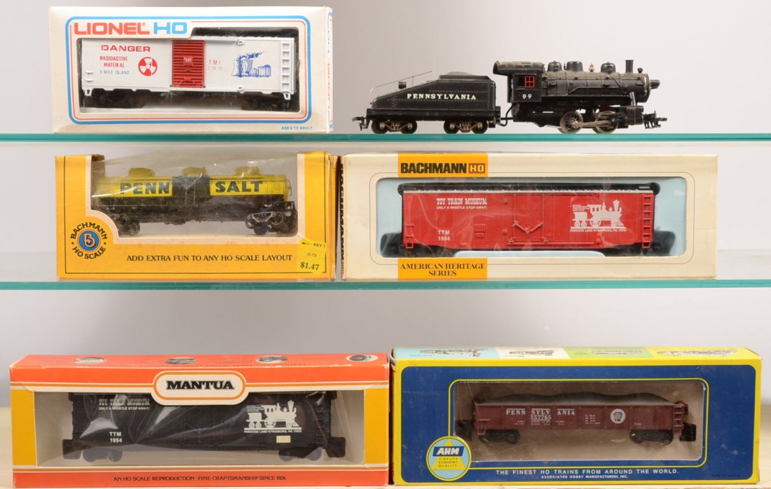 Six Pieces HO Toy Train Group. Mantua #99 Pennsylv: Six Pieces HO Toy Train Group. Mantua #99 Pennsylvania Shifter Engine with tender; #5531, AHM Pennsylvania gondola with stone load; two, red and black TTM 1954 Boxcars; yellow triple dome Penn Salt Ta