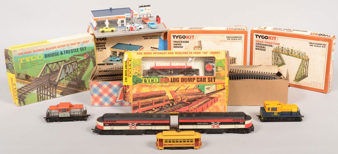 Mixed Group of HO Model Railroad Pieces. AHM, 370,: Mixed Group of HO Model Railroad Pieces. AHM, 370, New Haven double diesel engines. 332, A.T. & S.F. diesel shifter engine; a diesel General Electric shifter engine; a Main Street trolley car; over 75
