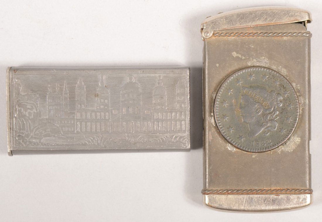 Two Metal Match Safes. An early type of cast pewter: Two Metal Match Safes. An early type of cast pewter with low relief designs of a steam boat with buildings on one side and domed and spired buildings on other. Spring hinged lid, 2 3/8"l. Along with a