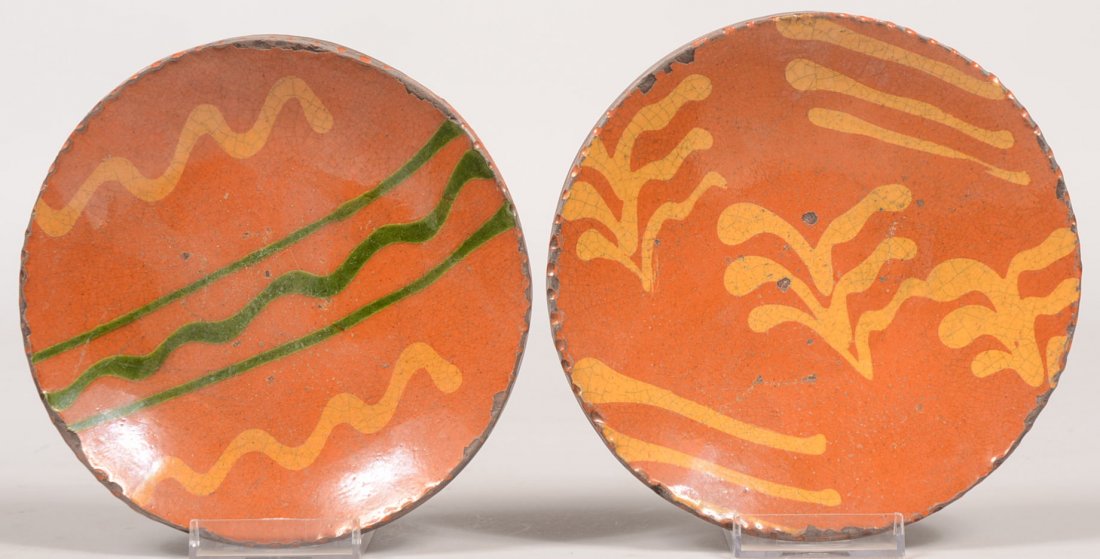 Two Small Redware Dishes. Coggle rims surround sli: Two Small Redware Dishes. Coggle rims surround slip decorated faces. Yellow lines and sprigs on one and green and yellow line decoration on other. Both signed "Greg Schooner, 2001" and also bear the P