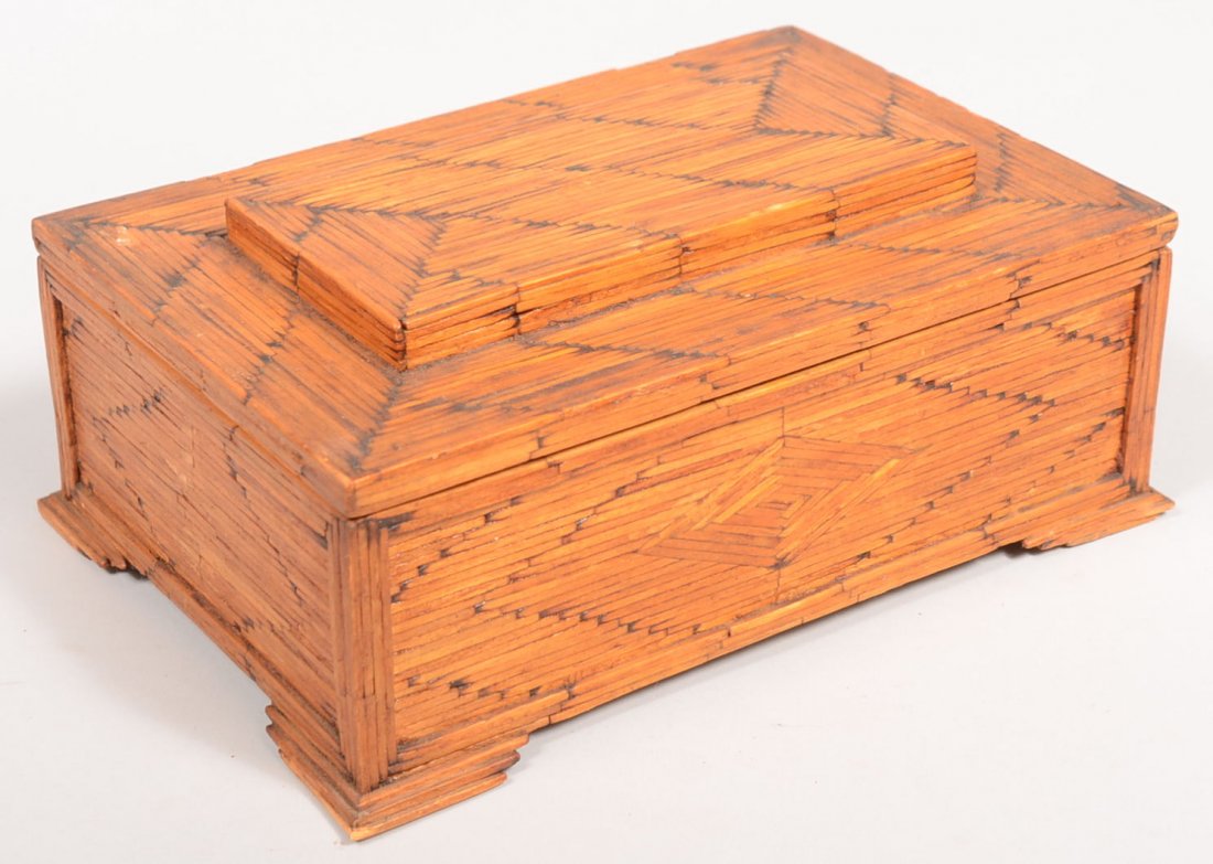 Burnt Matchstick Covered Tramp Art Trinket Box. Hi: Burnt Matchstick Covered Tramp Art Trinket Box. Hinged lid box has burnt tip wood matches arranged in decorative patterns on each side. Three level bracket feet. Box is lined with lilac bunches wallpa