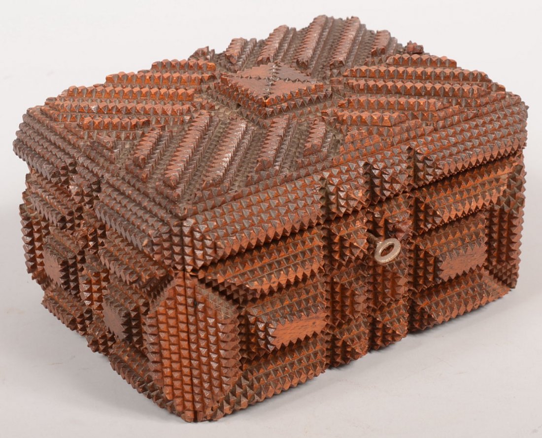 Tramp Art Lock Box. Dark stained glossy finished s: Tramp Art Lock Box. Dark stained glossy finished surface made up of multiple layered and geometric shaped pyramids of chip carved strips of wood. Hinged lid with hasp pin covers a purple velvet lined 