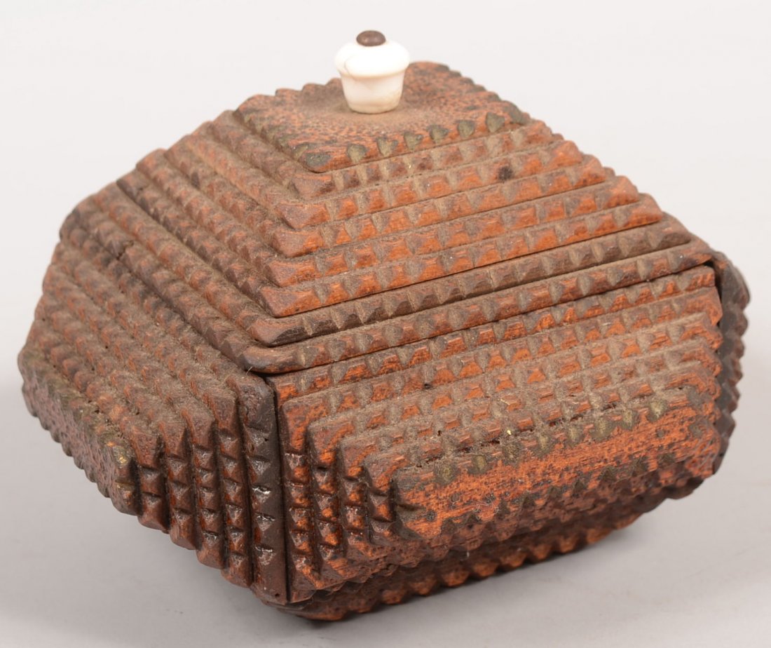 Tramp Art Chip Carved Square Box. Five, six and se: Tramp Art Chip Carved Square Box. Five, six and seven layer carved panels of wood stacked into a single pyramid on each side and lid. Lid has white porcelain knob. 4 1/2"h. X 6"w. X 5 1/2"d. Condition
