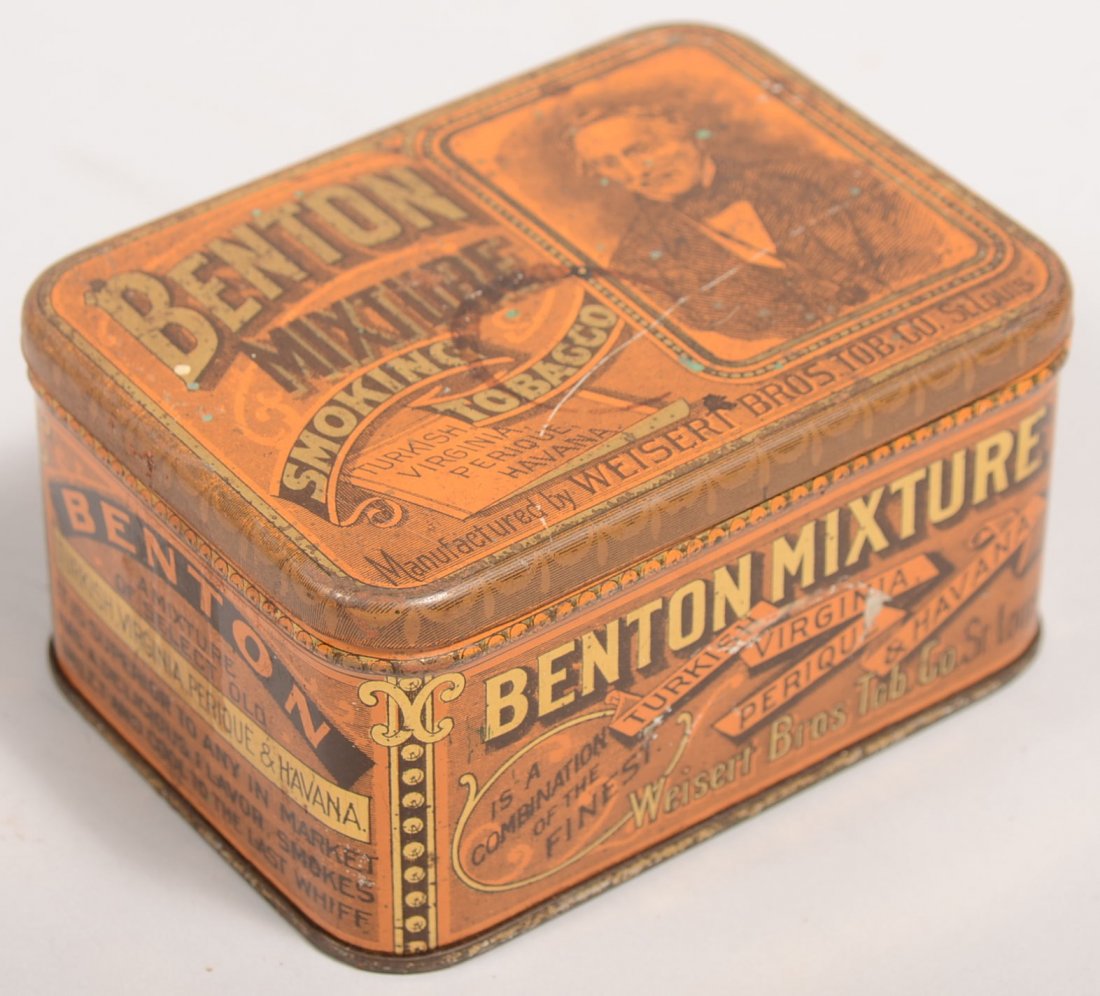 Tobacco Tin With Lithographic Illustrations. "Bent: Tobacco Tin With Lithographic Illustrations. "Benton Mixture Smoking Tobacco, Mfg. by Weisert Bros. Tob. Co., St. Louis." printed in brown and black on a brass plated tin box. 2 1/4"h. X 4 1/2"w. Cond