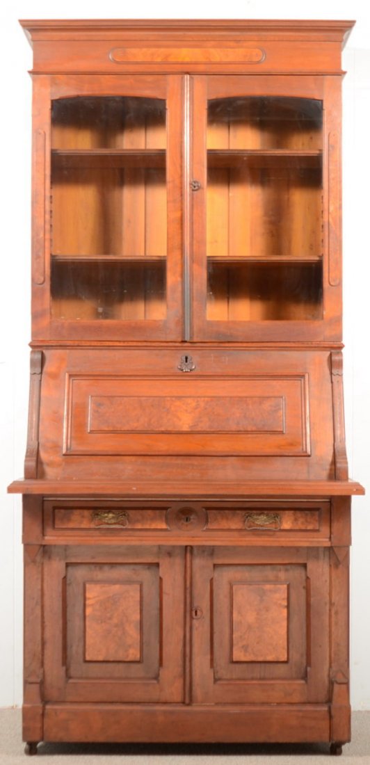 Victorian Walnut and Burl Walnut Slant-lid Secreta: Victorian Walnut and Burl Walnut Slant-lid Secretary Desk. Molded cornice, two glazed upper doors, desk compartment with fitted interior, skirt drawer, two lower raised panel doors and molded base83"h