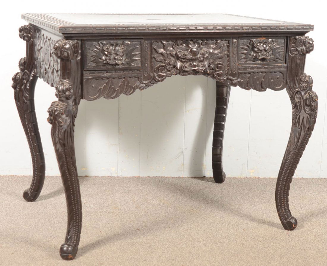 Late 19th/early 20th Century Lacquered Rosewood Hi: Late 19th/early 20th Century Lacquered Rosewood Highly Carved Chinese Library Table. Rectangular top with two skirt drawers and cabriole legs. 30"h x 39"w x 29"d. Condition: Good with normal wear.