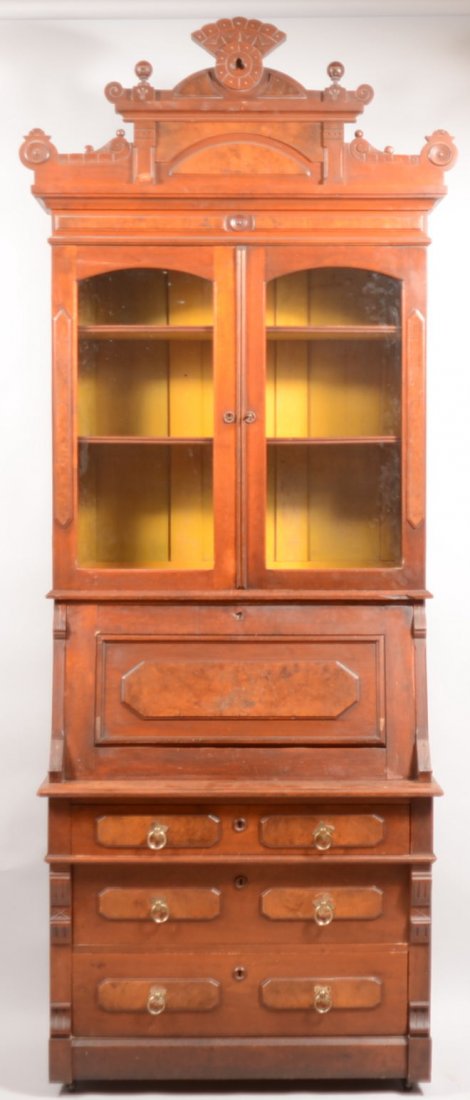 Victorian Walnut and Burl Walnut Slant-lid Secreta: Victorian Walnut and Burl Walnut Slant-lid Secretary Desk. Carved and molded with stepped cornice, two glazed upper doors, desk compartment with fitted interior and three full-width drawers. 103"h x 4