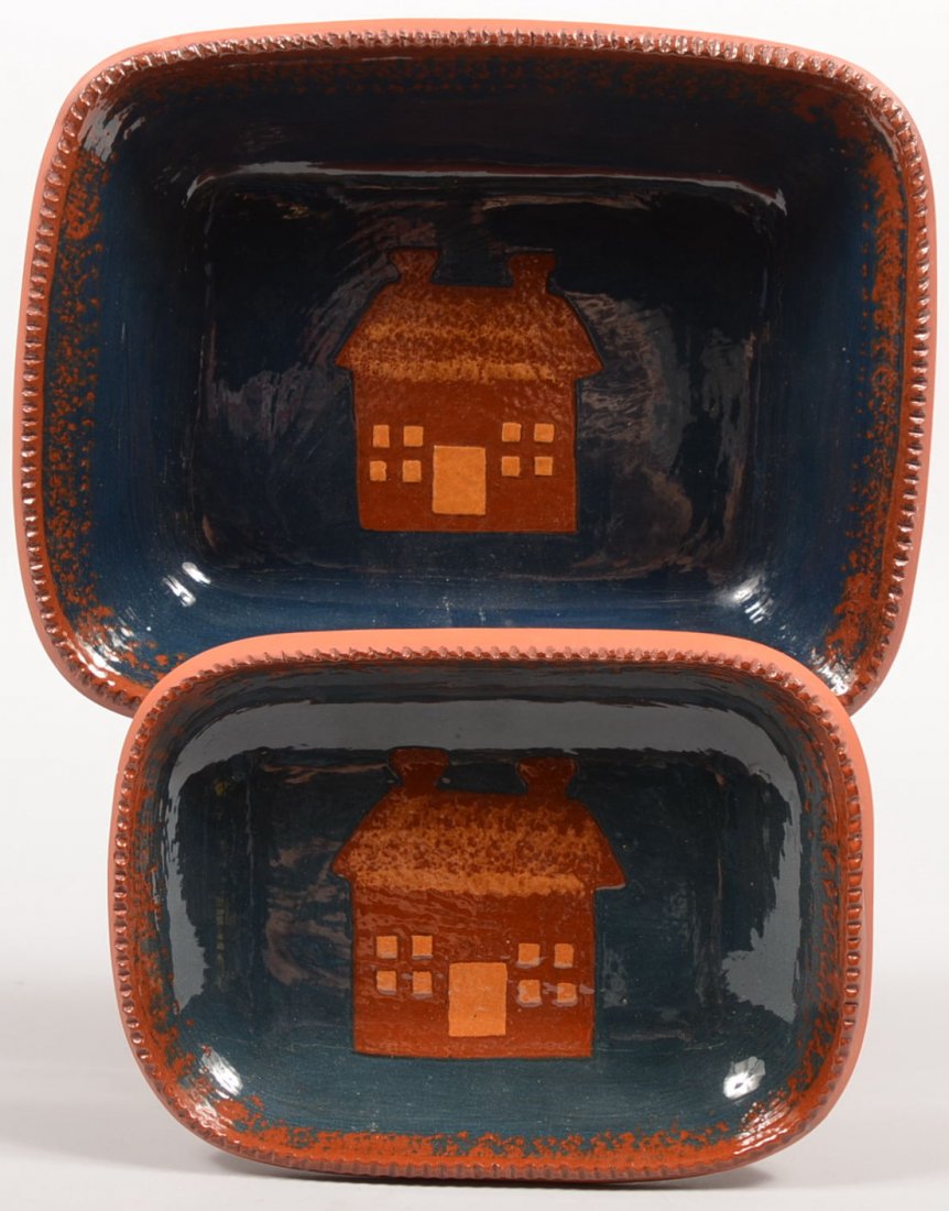 Two C. Ned Foltz Signed Redware Loaf Pans. Both di: Two C. Ned Foltz Signed Redware Loaf Pans. Both dishes have sponged and coggled rims, blue glazed interior with a house stencil showing yellow slip windows and door. Bottoms marked: "C.N. Foltz, Potte