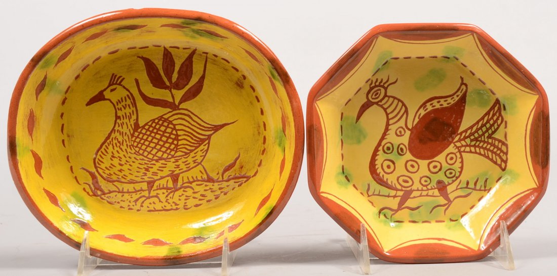 Two Seagraves Slip Decorated Redware Dishes. An oc: Two Seagraves Slip Decorated Redware Dishes. An octagonal dish with an incised peafowl on center and drapes around the rim panels. 6 1/4"dia. Along with an oblong dish having a bird and tulip incised