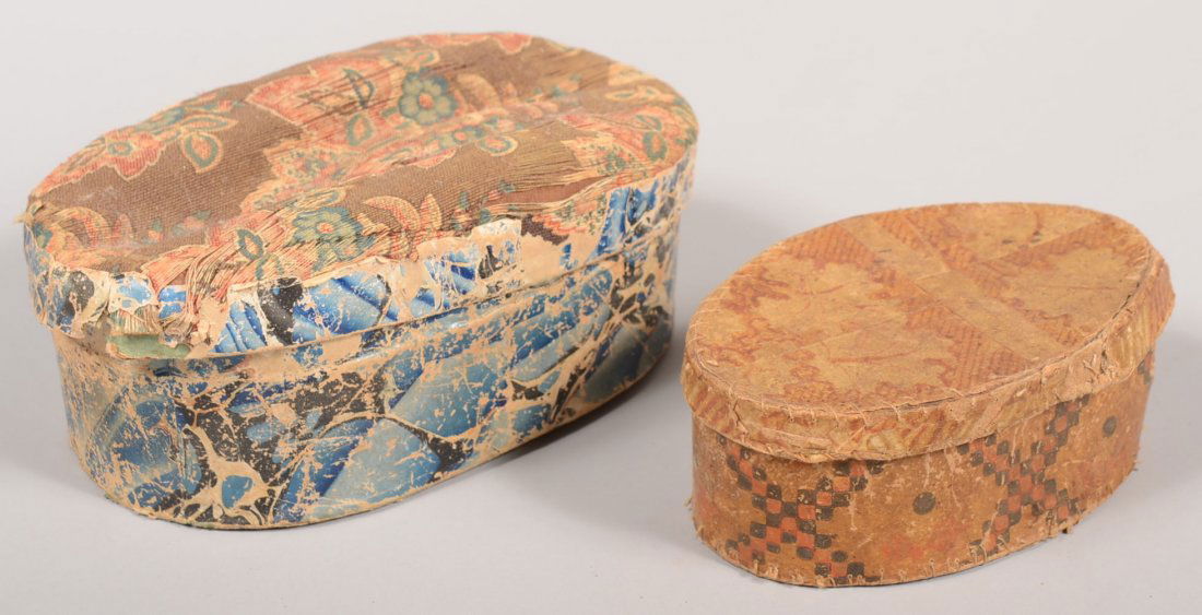 Two Early 19 Century Wallpaper Covered Oval Boxes.: Two Early 19 Century Wallpaper Covered Oval Boxes. First blue marbleized paper with floral fabric pin cushion top, 4"h x 8"w x 4 3/4"d. Second is Tan, red and dark brown with leaf design on lid and ge