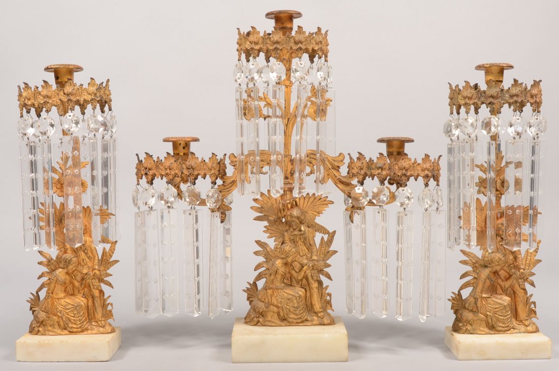 American 19th Century Gilt Metal and Marble Base T: American 19th Century Gilt Metal and Marble Base Three Piece Girandole Set. Cast as Paul and Virginie. Floral and rosette impressed drop prisms. Tallest 16 1/2" high. Condition: Good with minor wear a